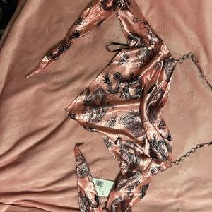 Never worn cute crop top shirt very much open in the back.